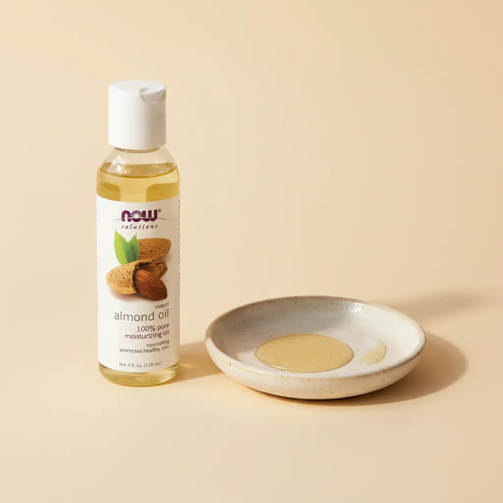 Premium detail shot - NOW Almond Oil texture showcase